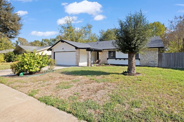 10001 Woodglen Dr, Austin, TX 78753 - ranch-style house featuring a garage, stone siding, concrete driveway, and roof with shingles