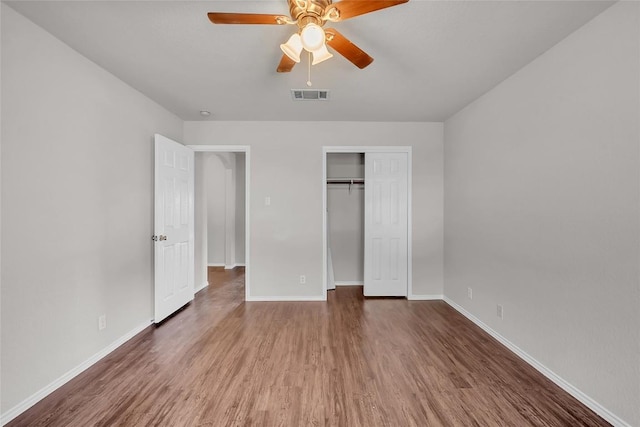 100 Grant Cv, Hutto, TX 78634 - unfurnished bedroom featuring wood finished floors, a closet, and a ceiling fan