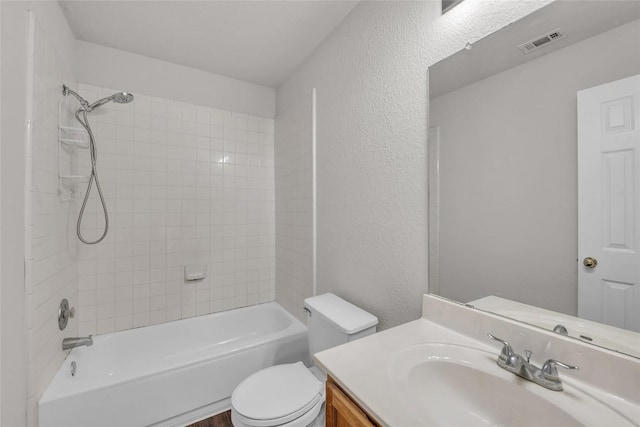 100 Grant Cv, Hutto, TX 78634 - bathroom featuring vanity, a textured wall, and  shower combination