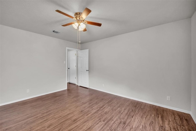 100 Grant Cv, Hutto, TX 78634 - empty room with wood finished floors and a ceiling fan