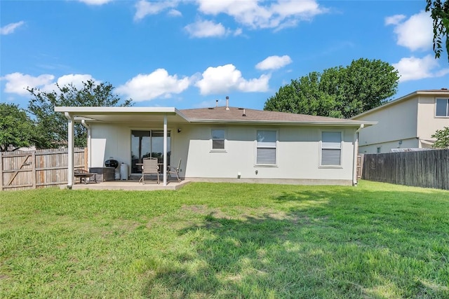 100 Grant Cv, Hutto, TX 78634 - rear view of house featuring a patio area, a fenced backyard, and stucco siding