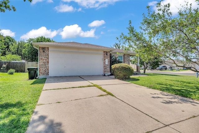 100 Grant Cv, Hutto, TX 78634 - view of front of home with driveway, brick siding, and a garage