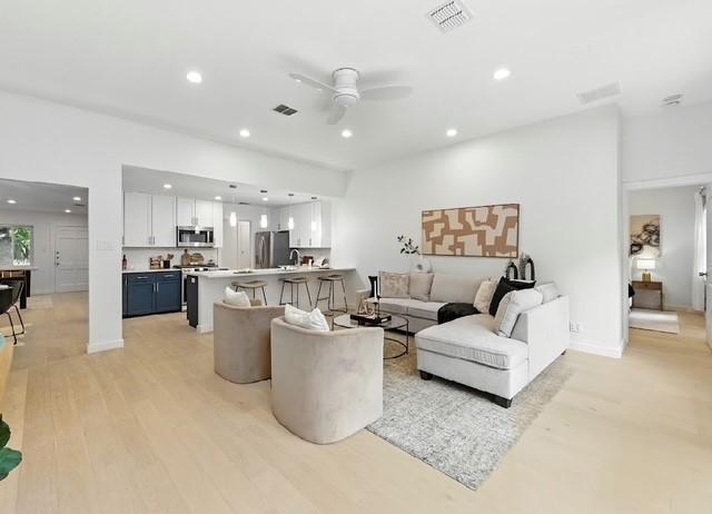 4508 Chiappero Trl, Austin, TX 78731 - living room with recessed lighting, a ceiling fan, and light wood-style floors