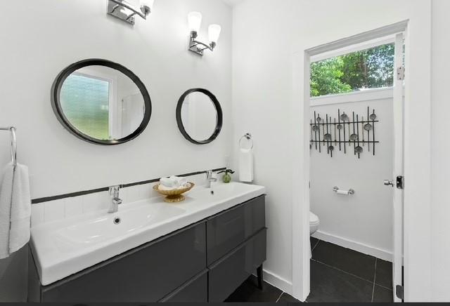 4508 Chiappero Trl, Austin, TX 78731 - full bath featuring double vanity and tile patterned flooring