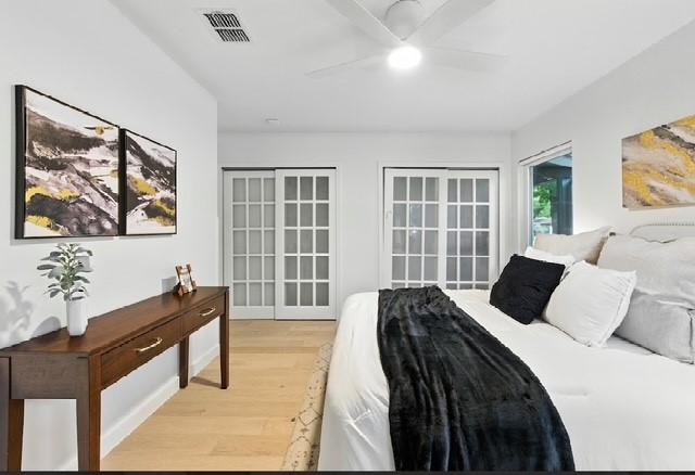 4508 Chiappero Trl, Austin, TX 78731 - bedroom with light wood-style flooring and a ceiling fan