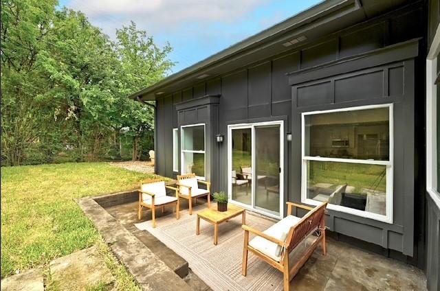 4508 Chiappero Trl, Austin, TX 78731 - back of property with board and batten siding and a lawn