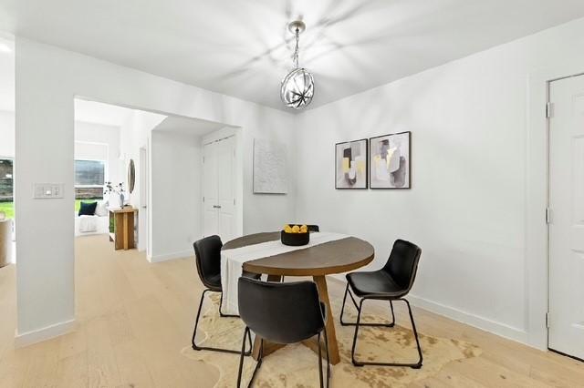4508 Chiappero Trl, Austin, TX 78731 - dining room with light wood-style floors and baseboards