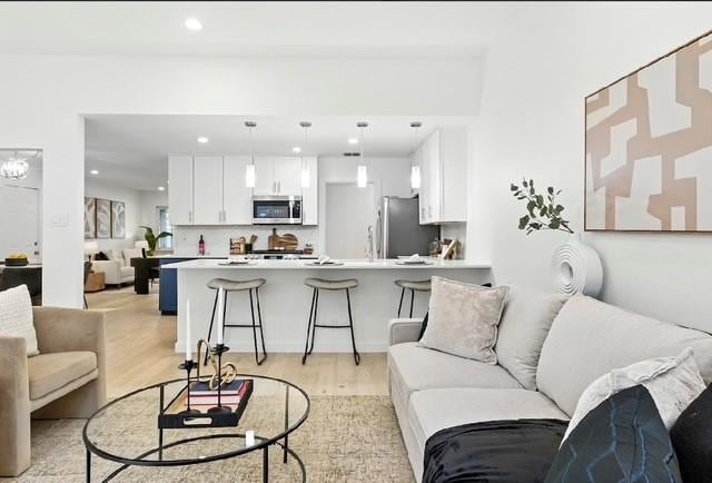 4508 Chiappero Trl, Austin, TX 78731 - living room with recessed lighting and light wood finished floors