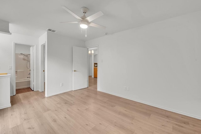 10616 Mellow Mdws Unit 17A, Austin, TX 78750 - unfurnished bedroom featuring light wood finished floors, connected bathroom, and ceiling fan