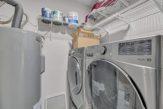 10616 Mellow Mdws Unit 17A, Austin, TX 78750 - laundry room with water heater and washer and clothes dryer