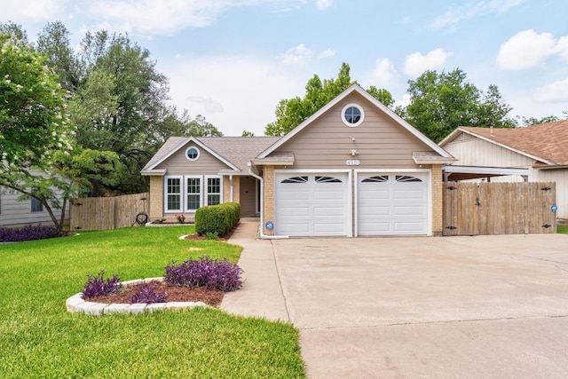 4901 Transit Cir, Austin, TX 78727 - view of front of house featuring a garage, concrete driveway, and brick siding