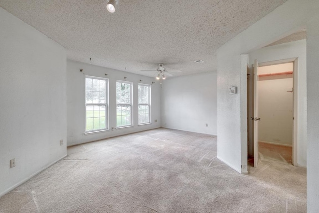 4901 Transit Cir, Austin, TX 78727 - carpeted empty room featuring a ceiling fan and a textured ceiling