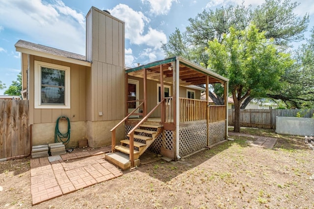 4901 Transit Cir, Austin, TX 78727 - rear view of property with a chimney