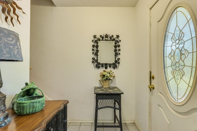 3508 Wendel Cv Unit H16, Austin, TX 78731 - entrance foyer featuring light tile patterned flooring and a textured ceiling