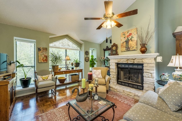 3508 Wendel Cv Unit H16, Austin, TX 78731 - living area with vaulted ceiling, a stone fireplace, and a ceiling fan