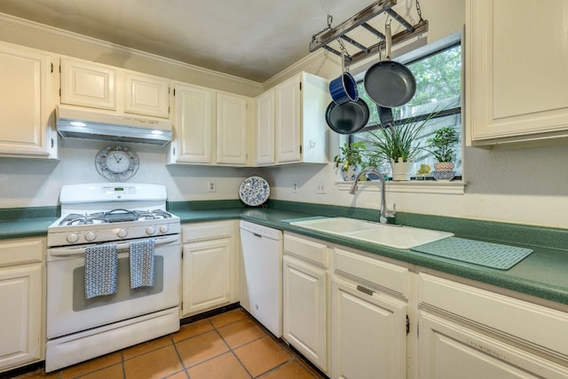 3508 Wendel Cv Unit H16, Austin, TX 78731 - kitchen with white appliances, under cabinet range hood, dark countertops, ornamental molding, and tile patterned floors