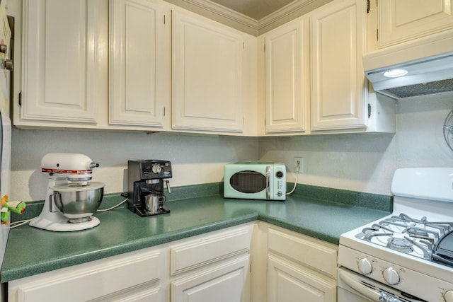 3508 Wendel Cv Unit H16, Austin, TX 78731 - kitchen with white appliances, under cabinet range hood, white cabinets, and dark countertops