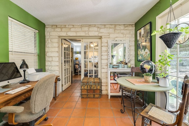 3508 Wendel Cv Unit H16, Austin, TX 78731 - tiled office space featuring french doors, plenty of natural light, and a textured ceiling