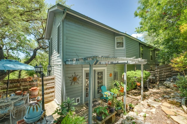 3508 Wendel Cv Unit H16, Austin, TX 78731 - back of house featuring a pergola