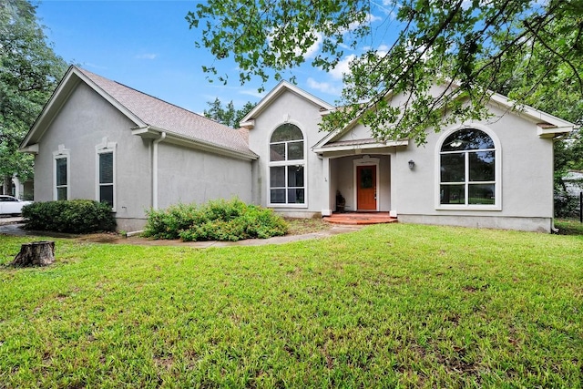 230 Cedar Hills Dr, Elgin, TX 78621 - view of front facade with stucco siding and a front yard