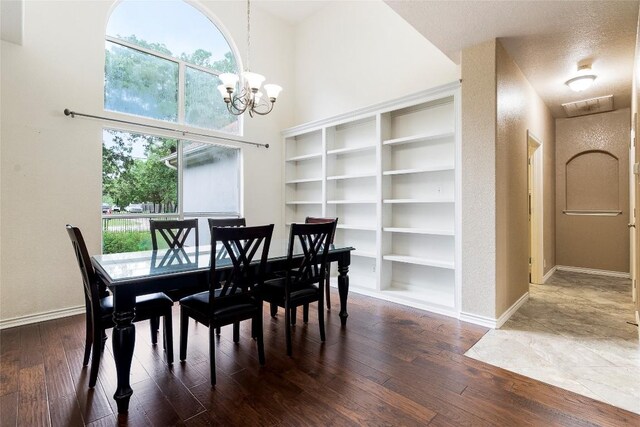 230 Cedar Hills Dr, Elgin, TX 78621 - dining area featuring dark wood-style floors, a chandelier, and plenty of natural light