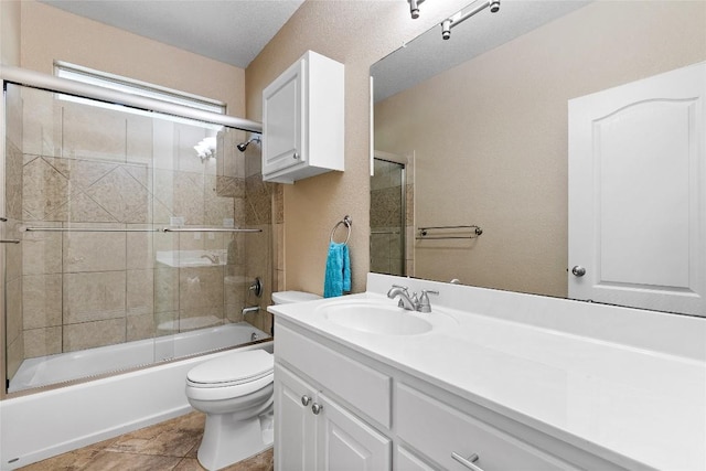 230 Cedar Hills Dr, Elgin, TX 78621 - full bath with vanity, shower / bath combination with glass door, and tile patterned flooring