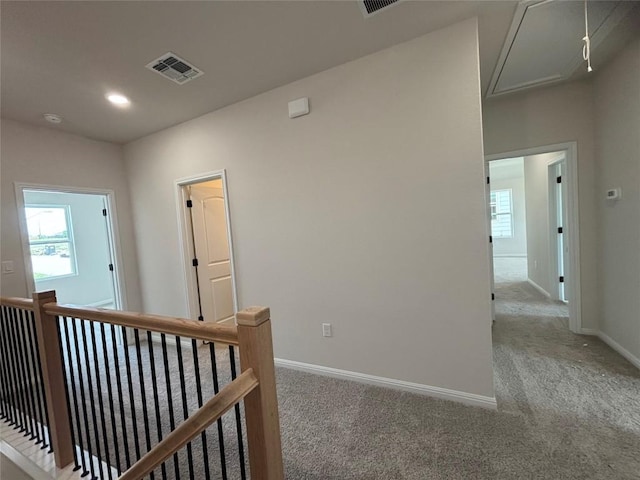 627 Palo Brea Loop, Hutto, TX 78634 - hallway featuring attic access, carpet flooring, an upstairs landing, and recessed lighting