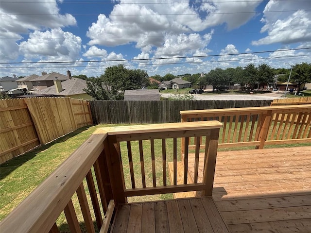 627 Palo Brea Loop, Hutto, TX 78634 - wooden terrace with a fenced backyard and a residential view