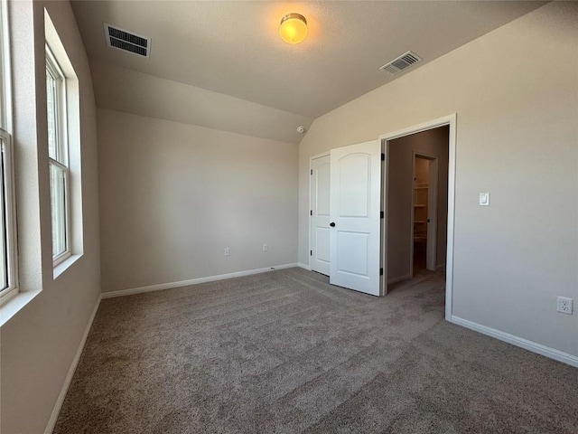 627 Palo Brea Loop, Hutto, TX 78634 - carpeted empty room with baseboards and vaulted ceiling
