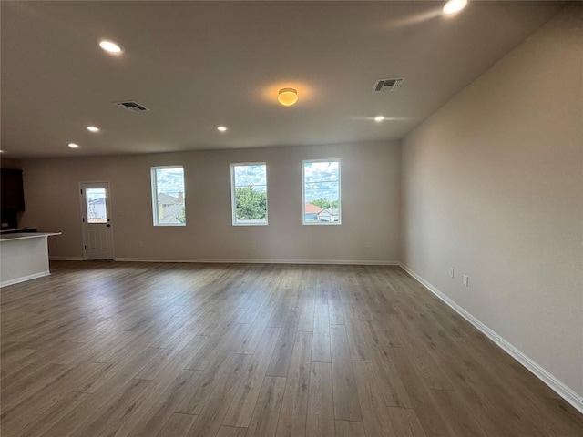 627 Palo Brea Loop, Hutto, TX 78634 - unfurnished room featuring recessed lighting and dark wood-type flooring