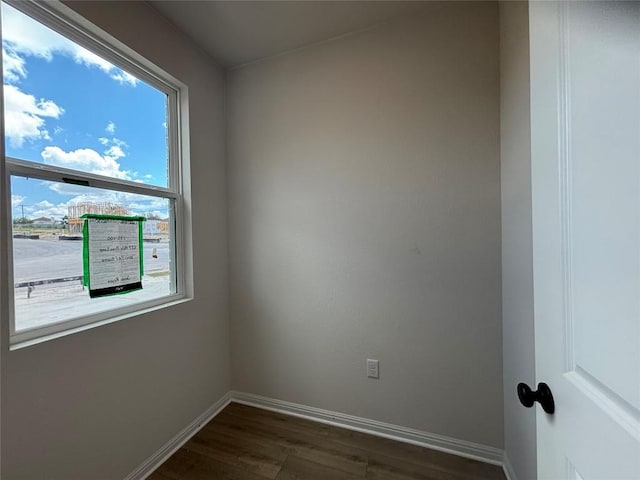 627 Palo Brea Loop, Hutto, TX 78634 - spare room with dark wood-style floors and baseboards