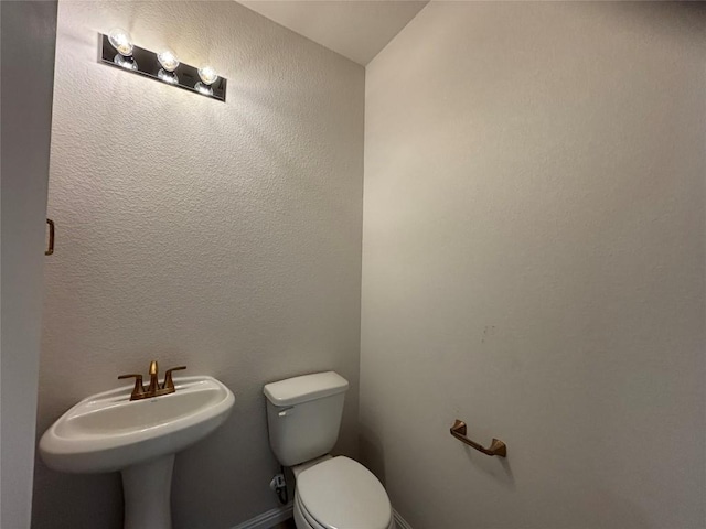 627 Palo Brea Loop, Hutto, TX 78634 - half bath with toilet and a sink
