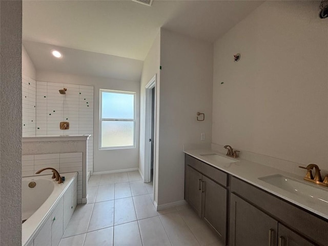 627 Palo Brea Loop, Hutto, TX 78634 - full bathroom with a garden tub, tile patterned floors, double vanity, tiled shower, and recessed lighting