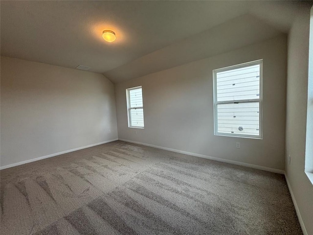 627 Palo Brea Loop, Hutto, TX 78634 - unfurnished room featuring lofted ceiling and carpet flooring