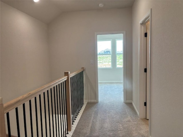 627 Palo Brea Loop, Hutto, TX 78634 - hallway with carpet floors, vaulted ceiling, and an upstairs landing