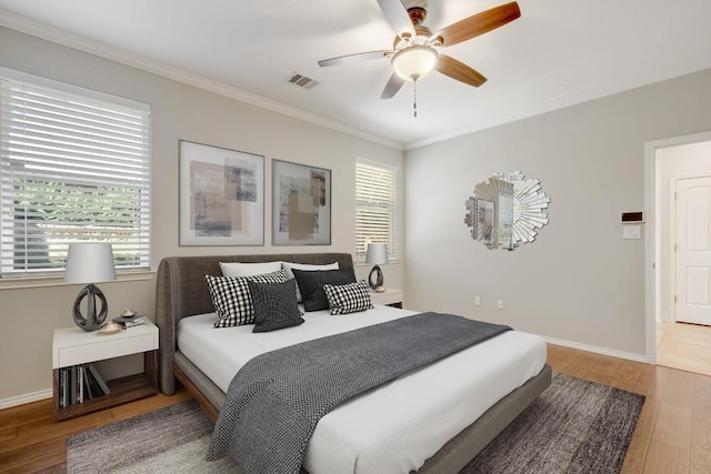 1209 Salem Park Ct, Austin, TX 78745 - bedroom featuring wood finished floors, ornamental molding, and ceiling fan