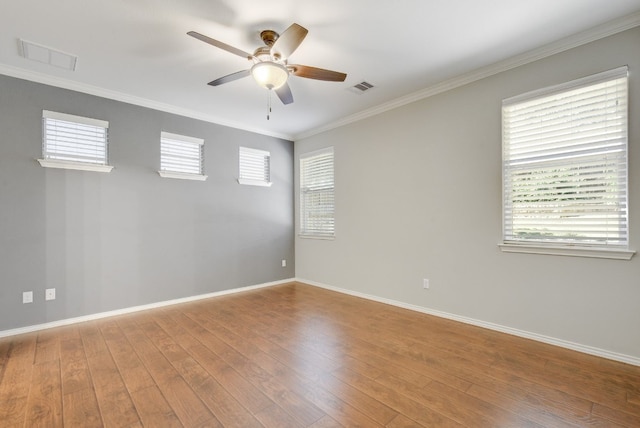 1209 Salem Park Ct, Austin, TX 78745 - unfurnished room featuring ceiling fan, plenty of natural light, hardwood / wood-style flooring, and ornamental molding