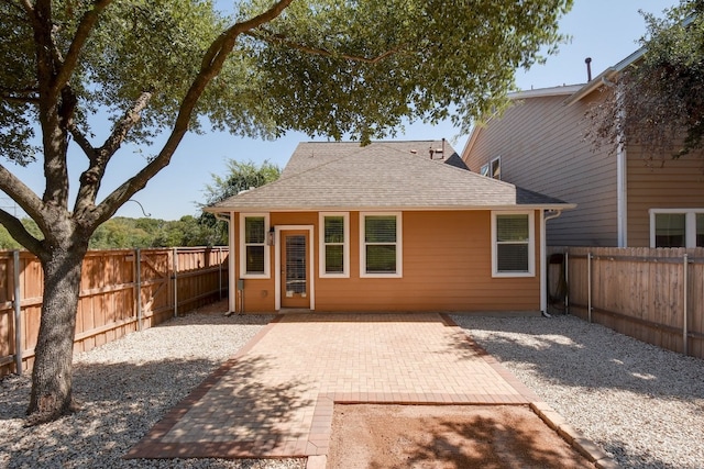 1209 Salem Park Ct, Austin, TX 78745 - rear view of property featuring a fenced backyard, a patio area, and roof with shingles