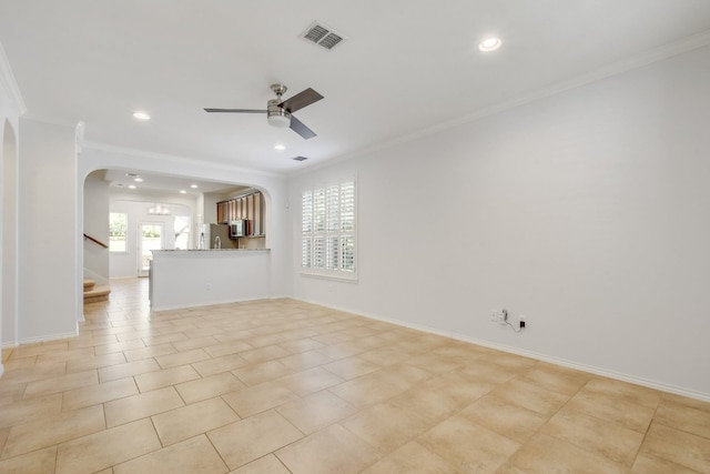 1209 Salem Park Ct, Austin, TX 78745 - unfurnished living room featuring ornamental molding, arched walkways, a ceiling fan, stairs, and recessed lighting