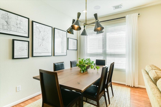 13412 Snow Fall Dr, Austin, TX 78727 - dining area with baseboards and light wood-style flooring