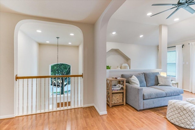 13412 Snow Fall Dr, Austin, TX 78727 - living area with arched walkways, a ceiling fan, wood finished floors, and recessed lighting