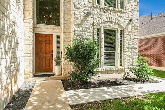 13412 Snow Fall Dr, Austin, TX 78727 - view of exterior entry featuring stone siding