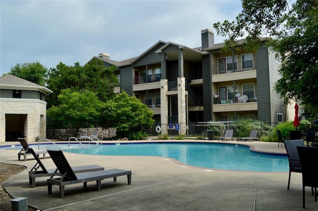 2320 Gracy Farms Ln Unit 1414, Austin, TX 78758 - community pool featuring a patio