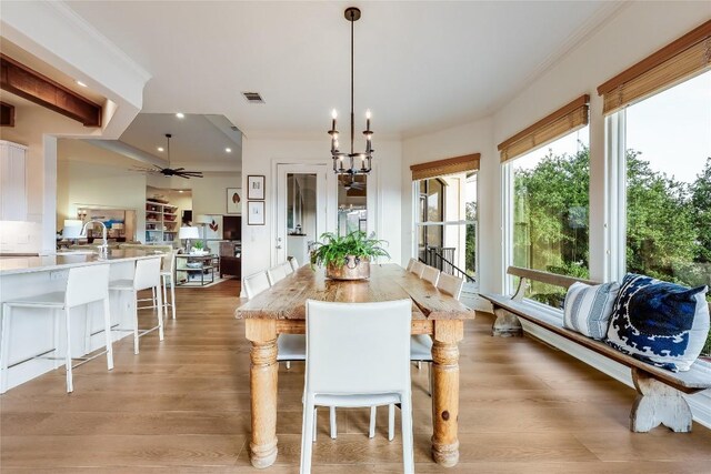 1307 Osprey Ridge Loop, Lago Vista, TX 78645 - dining area with a ceiling fan, light wood finished floors, recessed lighting, and a chandelier