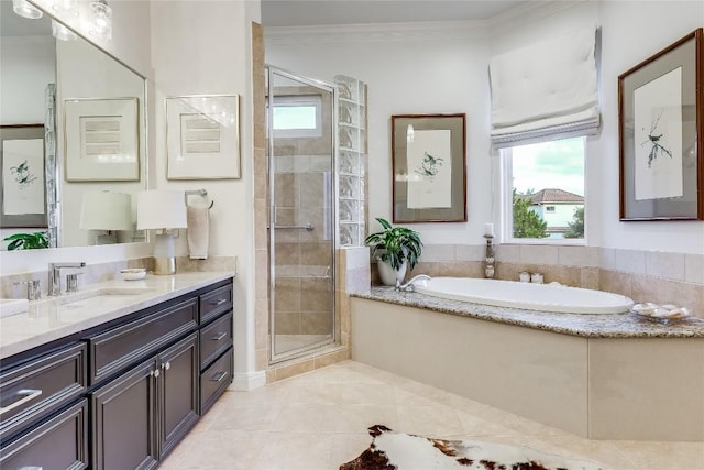 1307 Osprey Ridge Loop, Lago Vista, TX 78645 - full bathroom featuring vanity, a garden tub, a stall shower, tile patterned floors, and ornamental molding