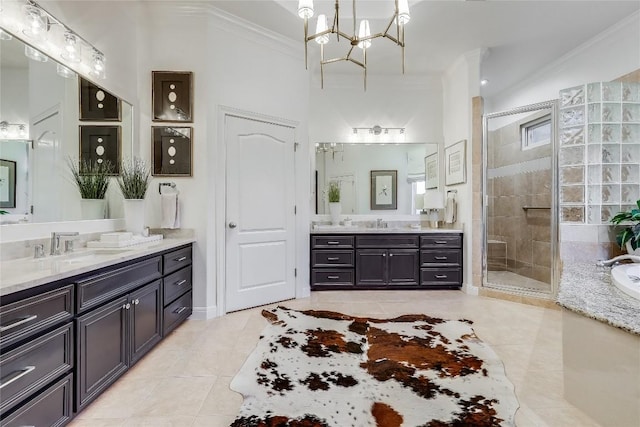 1307 Osprey Ridge Loop, Lago Vista, TX 78645 - full bath with tile patterned floors, crown molding, two vanities, a stall shower, and a bath
