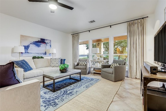 1307 Osprey Ridge Loop, Lago Vista, TX 78645 - living area with a ceiling fan and light tile patterned floors