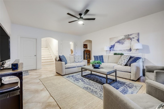 1307 Osprey Ridge Loop, Lago Vista, TX 78645 - living room with arched walkways, stairway, and ceiling fan