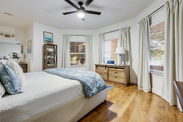 1307 Osprey Ridge Loop, Lago Vista, TX 78645 - bedroom featuring light wood-type flooring and a ceiling fan