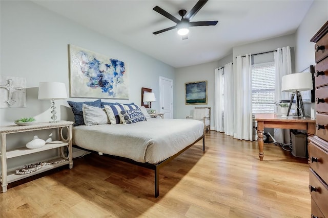 1307 Osprey Ridge Loop, Lago Vista, TX 78645 - bedroom featuring light wood finished floors and a ceiling fan